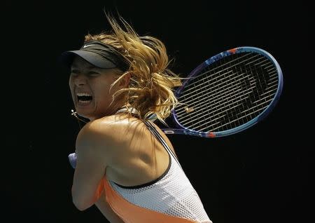 Russia's Maria Sharapova hits a shot during her quarter-final match against Serena Williams of the U.S. at the Australian Open tennis tournament at Melbourne Park, Australia, January 26, 2016. REUTERS/Issei Kato