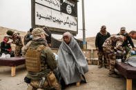 A woman injured in a mortar attack is treated by medics in a field clinic as Iraqi forces battle with Islamic State militants, in western Mosul, Iraq March 2, 2017. REUTERS/Zohra Bensemra