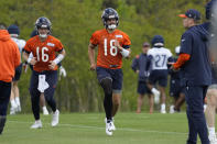 Chicago Bears quarterback Austin Reed (16) and quarterback Caleb Williams (18) warm up during the NFL football team's rookie camp at Halas Hall in Lake Forest, Ill., Friday, May 10, 2024. (AP Photo/Nam Y. Huh)