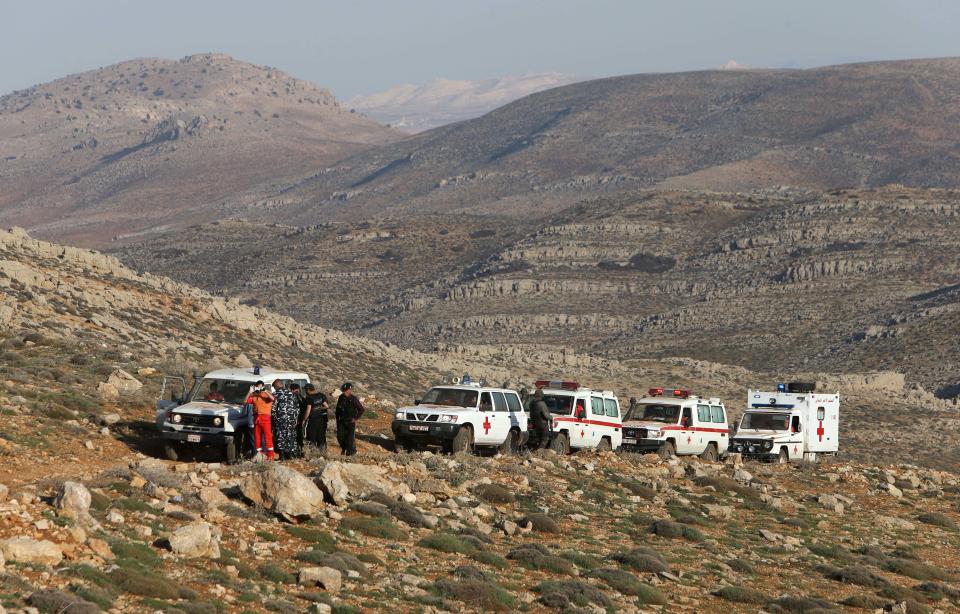 A convoy of Lebanese Red Cross ambulances carrying 11 Lebanese and Syrian injured people, is checked by the Lebanese army on their out from Tfail village, in the Ras al-Haref mountains at the Lebanese-Syrian border, eastern Lebanon, Tuesday April 22, 2014. A Lebanese convoy of soldiers, clerics and Red Cross officials delivered aid Tuesday to a remote village near the Syrian border that was bombed by Syrian government aircraft and blocked by Lebanese militants fighting alongside President Bashar Assad’s forces in the civil war next door. Hezbollah fighters have been patrolling the area on the Lebanese side and fighting has flared up inside Syria, cutting Tfail’s residents off from all sides for months. (AP Photo/Hussein Malla)