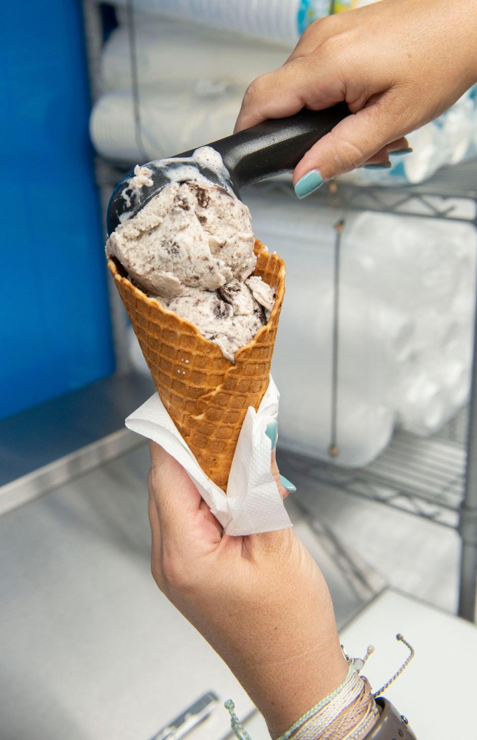 Charlene Cook loads up an ice cream cone at her new food truck, the Turtle Roll, in Gulf Breeze on Tuesday, Jan. 25, 2022. The Turtle Roll is one of the full-time vendors operating out of the new The Eatery food truck park in Gulf Breeze.