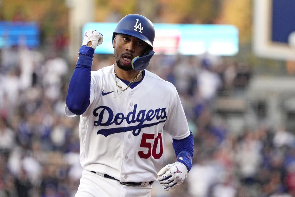 Los Angeles Dodgers' Mookie Betts gestures as he rounds third after hitting a solo home run during the third inning of a baseball game against the Los Angeles Angels Friday, July 7, 2023, in Los Angeles. (AP Photo/Mark J. Terrill)