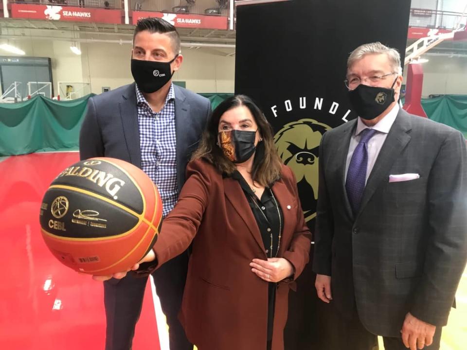 From left: Canadian Elite Basketball League Commissioner Mike Morreale, Memorial University President Vianne Timmons and Deacon Sports and Entertainment Owner Dean McDonald announced the arrival of the Newfoundland Growlers Basketball Club on Friday. It's the 10th franchise in the rapidly expanding CEBL. (Terry Roberts/CBC - image credit)