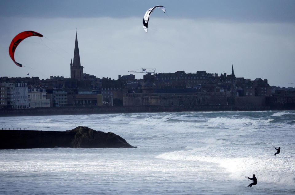 Kite surfers ride the waves in windy weather on the sea in Saint-Malo, France, on Jan. 16, 2023.