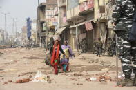 DELHI, INDIA - FEBRUARY 26 : Locals move away from Bhagirathi Vihar in Mustafabad following the Citizenship Amendment Act (CAA) clashes in Delhi, India on February 26, 2020. (Photo by Javed Sultan/Anadolu Agency via Getty Images)