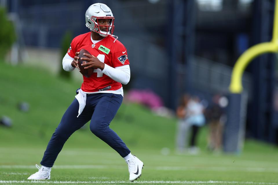 Free-agent quarterback Jacoby Brissett makes a throw during a OTA practice session in May. He will likely start while rookie QB Drake Maye   develops.