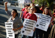 Chicago school teachers picket outside Wells High School on September 10, 2012 in Chicago, Illinois. More than 26,000 teachers and support staff hit the picket lines this morning after the Chicago Teachers Union failed to reach an agreement with the city on compensation, benefits and job security. With about 350,000 students, the Chicago school district is the third largest in the United States. (Photo by Scott Olson/Getty Images)