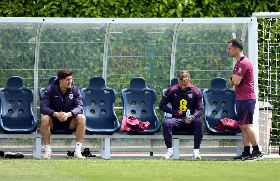 Harry Maguire watches on as England train today (Action Images via Reuters)