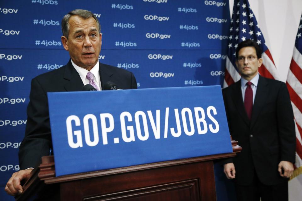 U.S. House Speaker Boehner is flanked by House Majority Leader Cantor as he holds a news conference after a House Republican caucus meeting in Washington