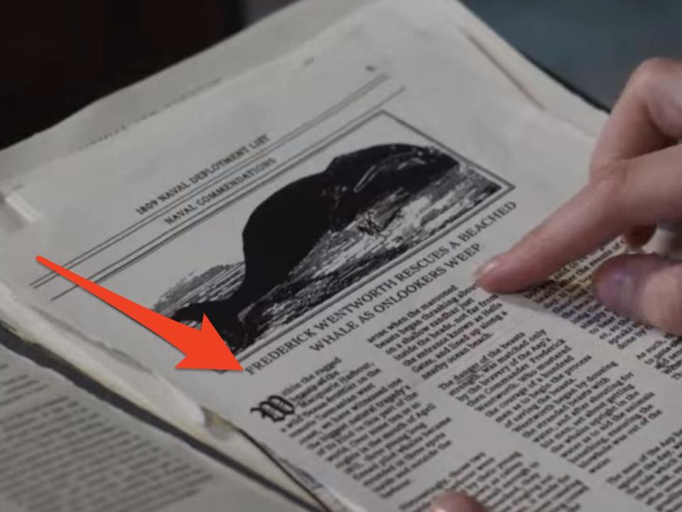 an arrow drawn on a picture of the beached whale article in Persuasion with a hand on top of the article