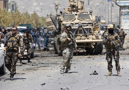 NATO troops arrive at the site of a suicide car bomb attack in Kabul August 10, 2014. REUTERS/Omar Sobhani