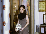 Pippa Middleton, sister to the Duchess of Cambridge, formerly known as Kate Middleton, poses for the media as she arrives at a bookshop to promote her new book "Celebrate: A Year of British festivities for families and friends", in London Thursday, Oct. 25, 2012. (AP Photo/Kirsty Wigglesworth)