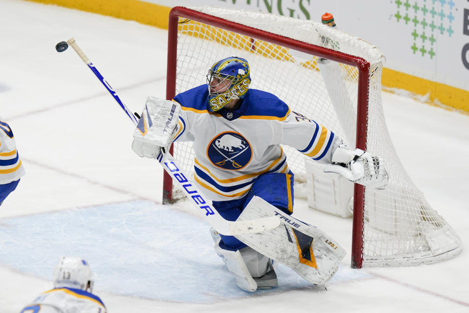 Buffalo Sabres goaltender Jonas Johansson deflects a shot during the third period of the team's NHL hockey game against the New York Islanders on Thursday, March 4, 2021, in Uniondale, N.Y. (AP Photo/Frank Franklin II)