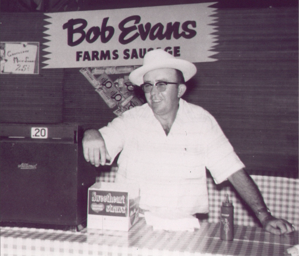 A young Bob Evans in his sausage shop.