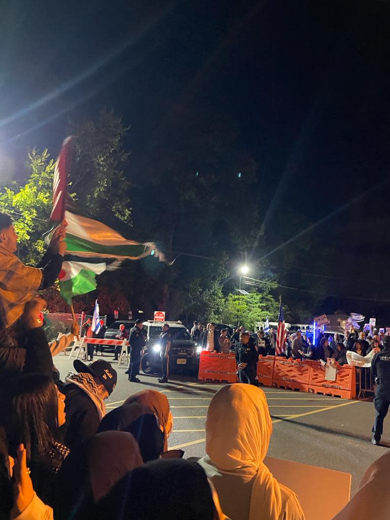 Protesters and supporters rallied outside the Teaneck Municipal Building on Oct. 18, where the council considered a resolution supporting Israel and denouncing Hamas.