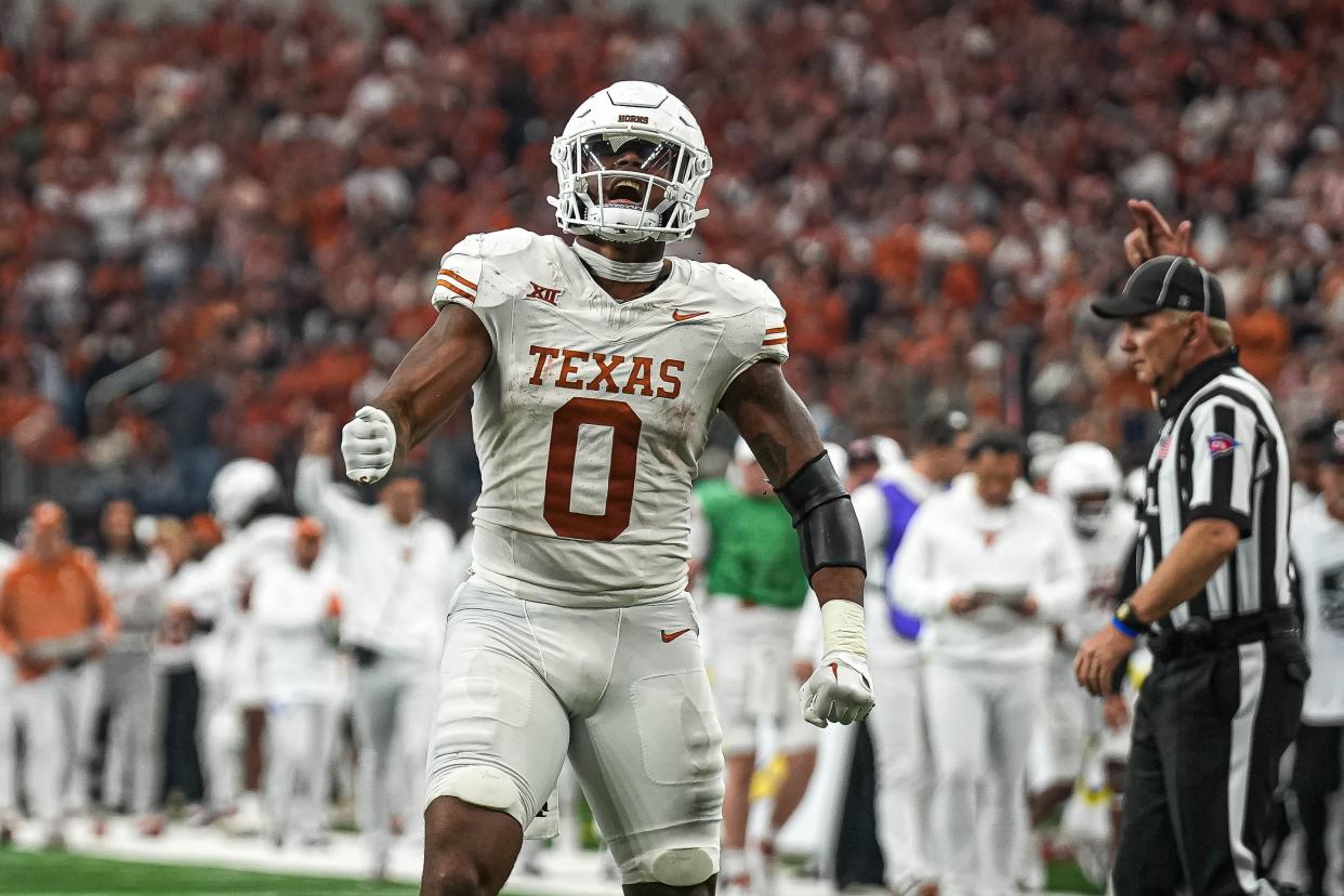 Texas Longhorns wide receiver Ja'Tavion Sanders (0) celebrates a catch for a first down during the Big 12 Championship game against the Oklahoma State Cowboys at AT&T stadium on Saturday, Dec. 2, 2023 in Arlington.
