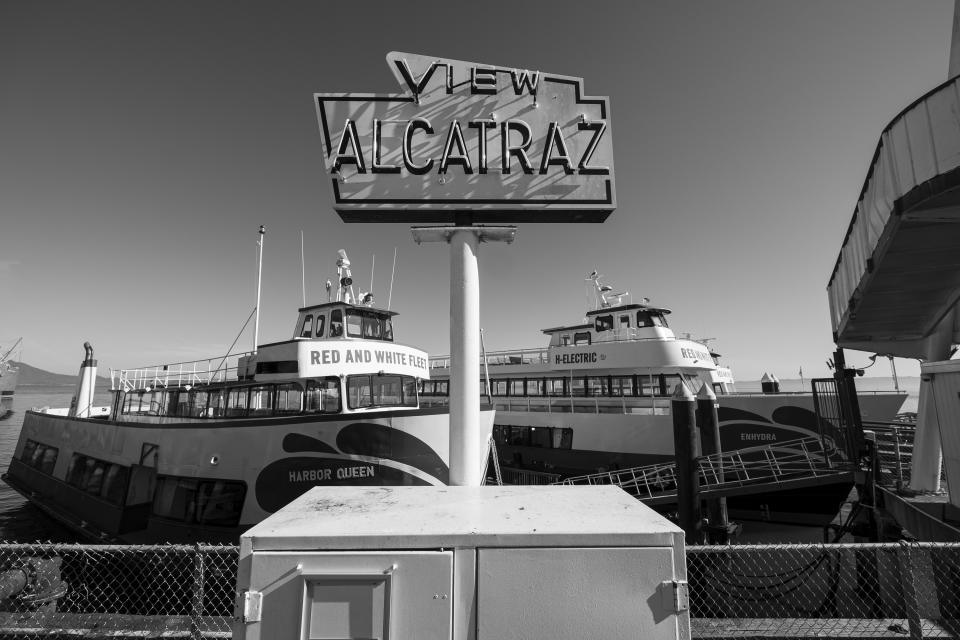 Bay cruise tour boats sit tied up to a pier at Fisherman's Wharf in San Francisco on April 24, 2020. Normally, the months leading into summer bring bustling crowds to the city's famous landmarks, but this year, because of the coronavirus threat they sit empty and quiet. Some parts are like eerie ghost towns or stark scenes from a science fiction movie. (AP Photo/Eric Risberg)