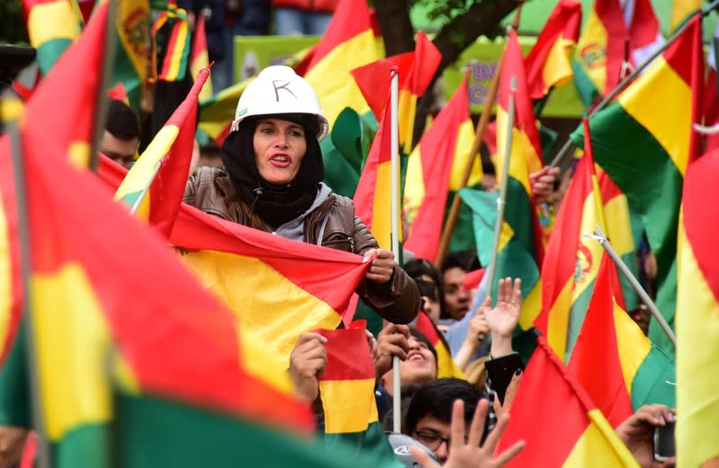 People celebrate after Bolivia's President Evo Morales announced that he will resign, in La Paz