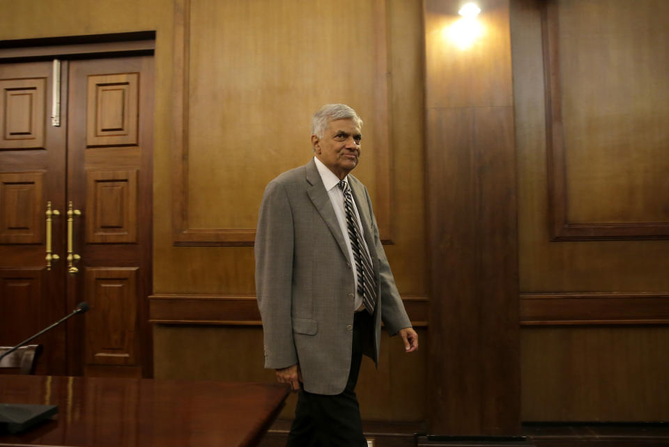 Sri Lankan Prime Minister Ranil Wickremesinghe arrives for an interview with the Associated Press at his office in Colombo, Sri Lanka, Thursday, April 25, 2019. Wickremesinghe has acknowledged to The Associated Press that minority Ahmadi Muslims who are refugees from Pakistan have faced attacks since the Easter bombings. He said Thursday that security forces were trying to help the Ahmadis. (AP Photo/Eranga Jayawardena)