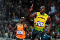 Usain Bolt of Jamaica celebrates winning gold in the Men?s 100m Final on Day 9 of the London 2012 Olympic Games at the Olympic Stadium on August 5, 2012 in London, England. (Photo by Stu Forster/Getty Images)