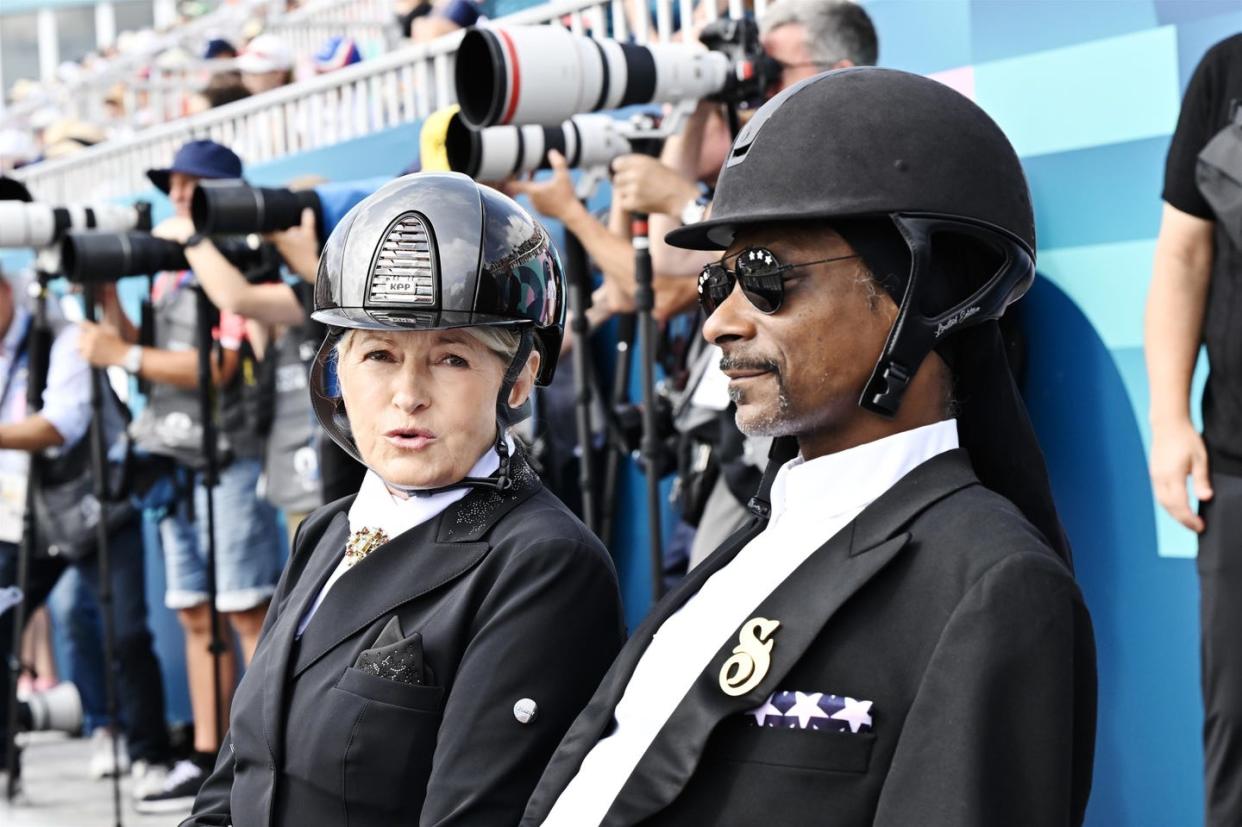 martha stewart and snoop dogg watching the equestrian finals at the 2024 paris olympics on august 2, 2024