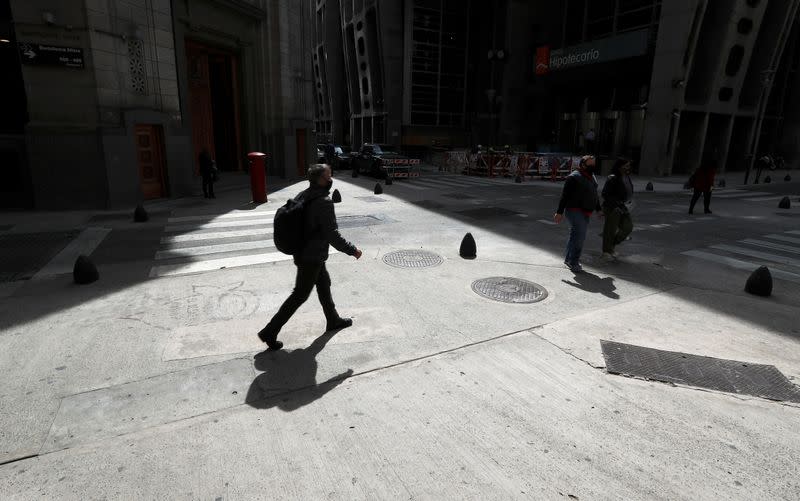 Pedestrians walk in Buenos Aires' financial district