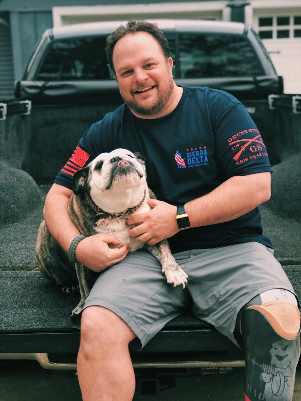 BJ Ganem, CEO and founder of Sierra Delta Service Dog Network for Veterans, with his own life-saving friend.