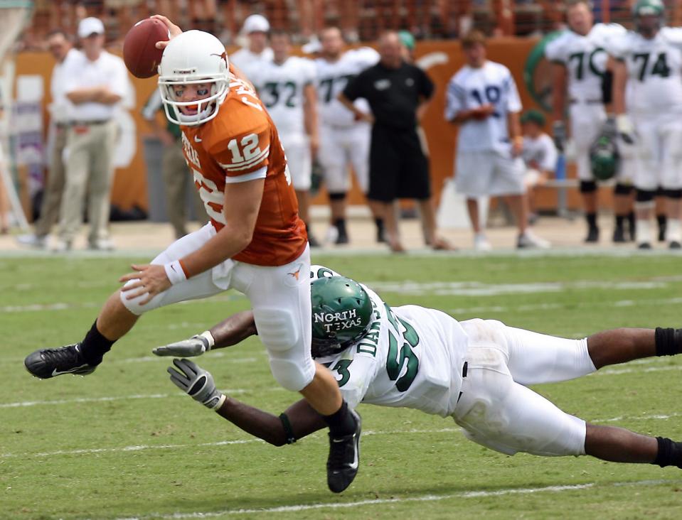 Texas quarterback Colt McCoy eludes a tackle during his first collegiate start on Sept. 2, 2006, at Royal-Memorial Stadium. McCoy eventually became one of the greatest quarterbacks in school history.