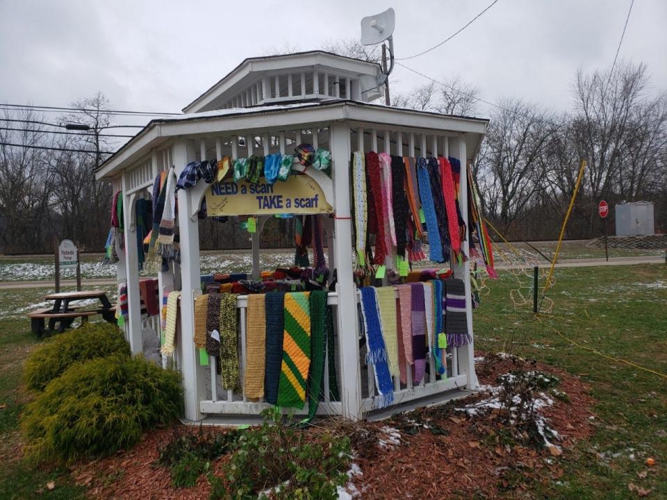 Scarves hang ready to be taken at the gazebo in Uhrichsville on Nov. 18 for distribution by the Scarf Project.