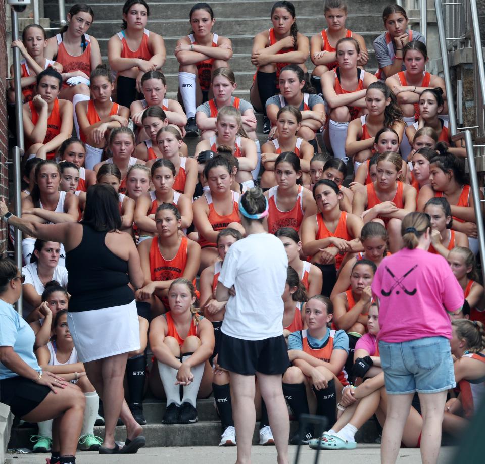 Mamaroneck field hockey coach Trish Miller talks to varsity and JV players before the start of practice at Mamaroneck High School   Aug. 22, 2023. 