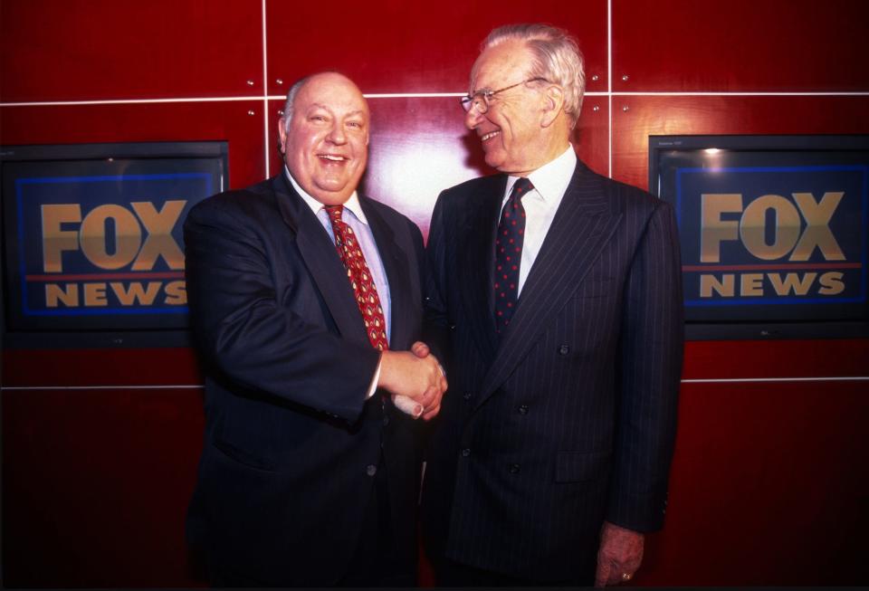 Rupert Murdoch shakes hands with Roger Ailes after naming Ailes the head of Fox News, New York, New York, January 30, 1996.