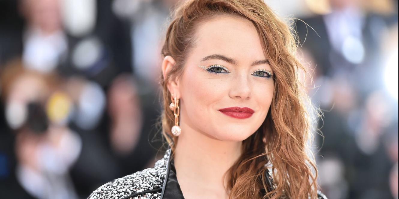Emma Stone is vacation-ready in chic green top at Louis Vuitton