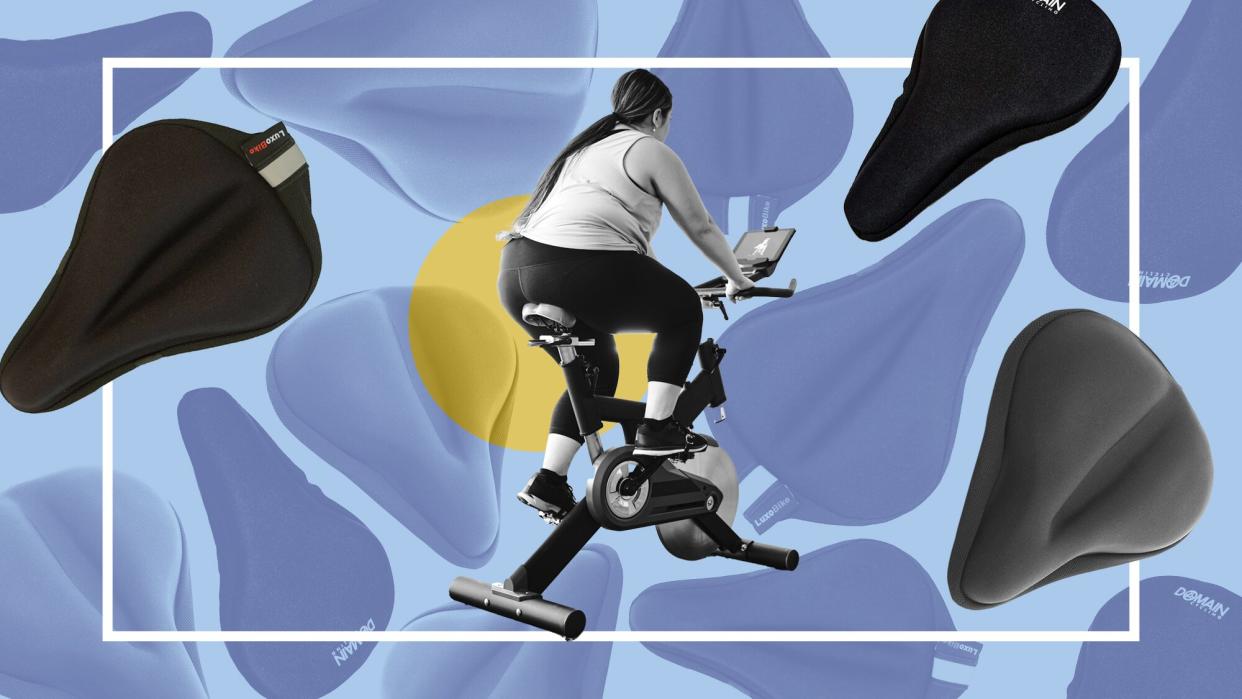 These Peloton Seat Cushions Make Any Bike More Comfortable , A woman exercising in her home on an exercise bike.