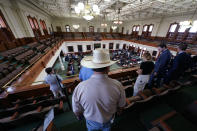 Members of the public arrive for the afternoon session during day five of the impeachment trial for Texas Attorney General Ken Paxton in the Senate Chamber at the Texas Capitol, Monday, Sept. 11, 2023, in Austin, Texas. (AP Photo/Eric Gay)