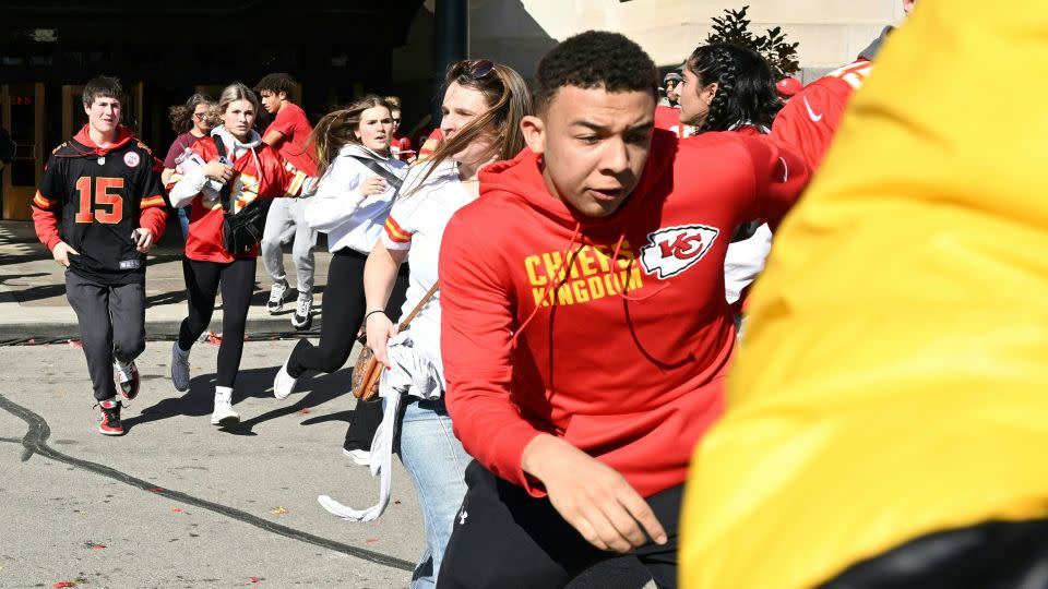 People flee after shots were fired near the Kansas City Chiefs' Super Bowl LVIII victory parade on February 14, 2024, in Kansas City, Missouri. - Andrew Caballero-Reynolds/AFP/Getty Images