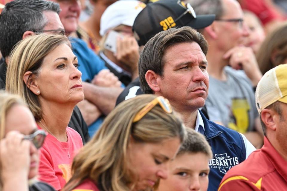 Iowa Gov. Kim Reynolds (left), and Florida Gov. Ron DeSantis attend a football game in Jack Trice Stadium, in Ames, Iowa, on Sept. 9, 2023.