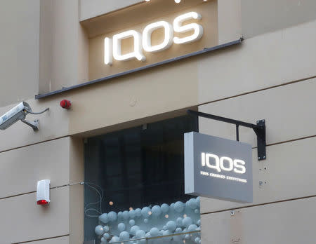 iQOS signs are pictured on a shop in Vilnius, Lithuania December 6, 2017. REUTERS/Ints Kalnins/Files