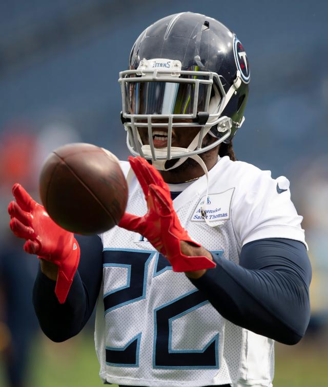 Tennessee Titans' Derrick Henry, Jeffery Simmons report for