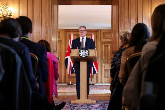 Sir Keir Starmer standing behind a lectern with the prime ministerial seal on it talking to rows of reporters in Downing Street