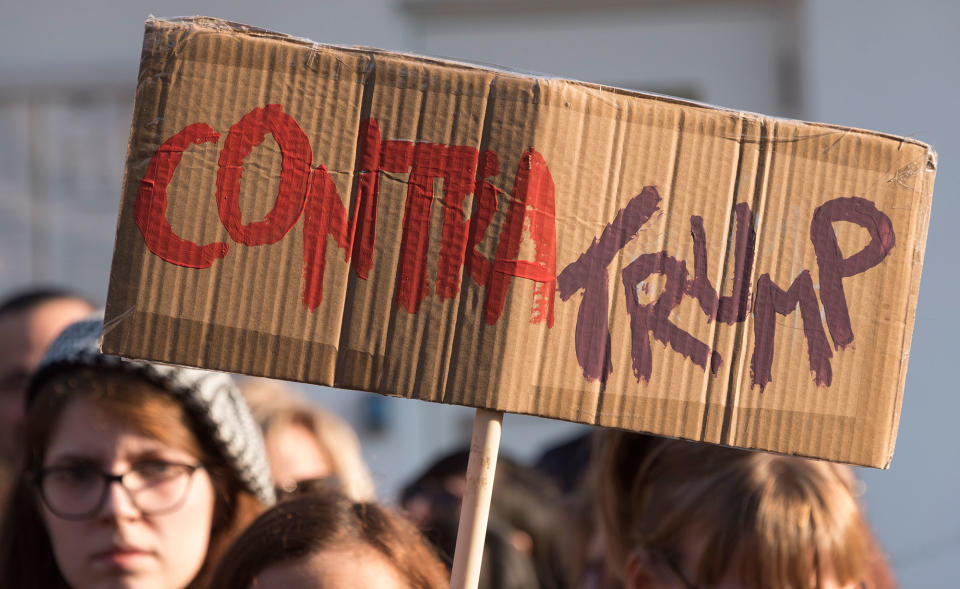 <p>Demonstrators gather to protest against US President Donald Trump in front of the US Embassy on January 21, 2017 in Lisbon, Portugal. Simultaneous protests have been staged, mainly by women, in many different countries against Trump’s behavior to women. (Horacio Villalobos – Corbis/Corbis via Getty Images) </p>