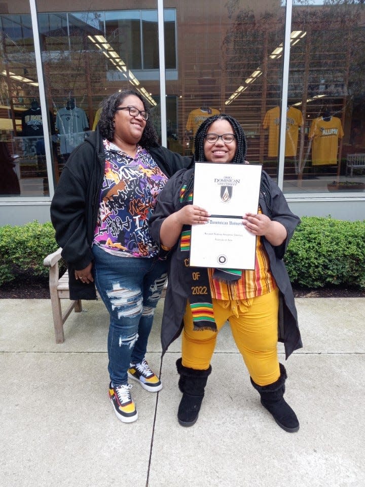 Elizabeth Eberhart, left, celebrates her daughter Kezayah's recent graduation from Ohio Dominican University. She became eligible for the Child Tax Credit because she has custody of three young grandchildren and said the government money helped with a little bit of everything.
