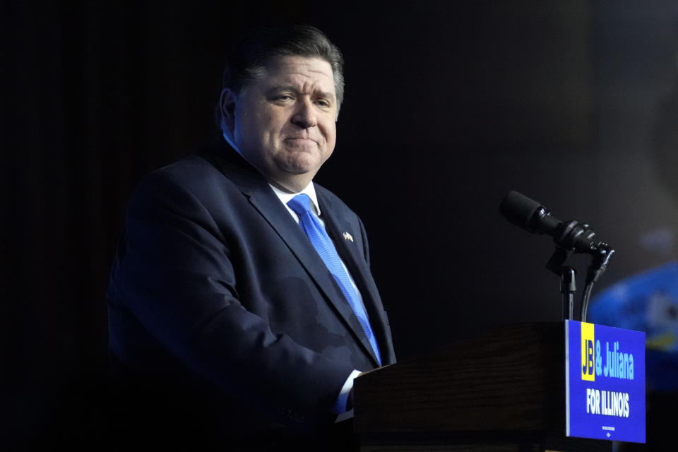 FILE - Illinois Gov. J.B. Pritzker looks to supporters after he defeated GOP challenger Darren Bailey on Nov. 8, 2022, in Chicago. Legal challenges to Illinois' semiautomatic weapons ban began Wednesday, Jan. 18, 2023, with a federal complaint that the eight-day-old law prohibits “commonly possessed” and constitutionally protected guns and a state court pleading questioning the law's exemptions based on a person's employment. (AP Photo/Nam Y. Huh, File)