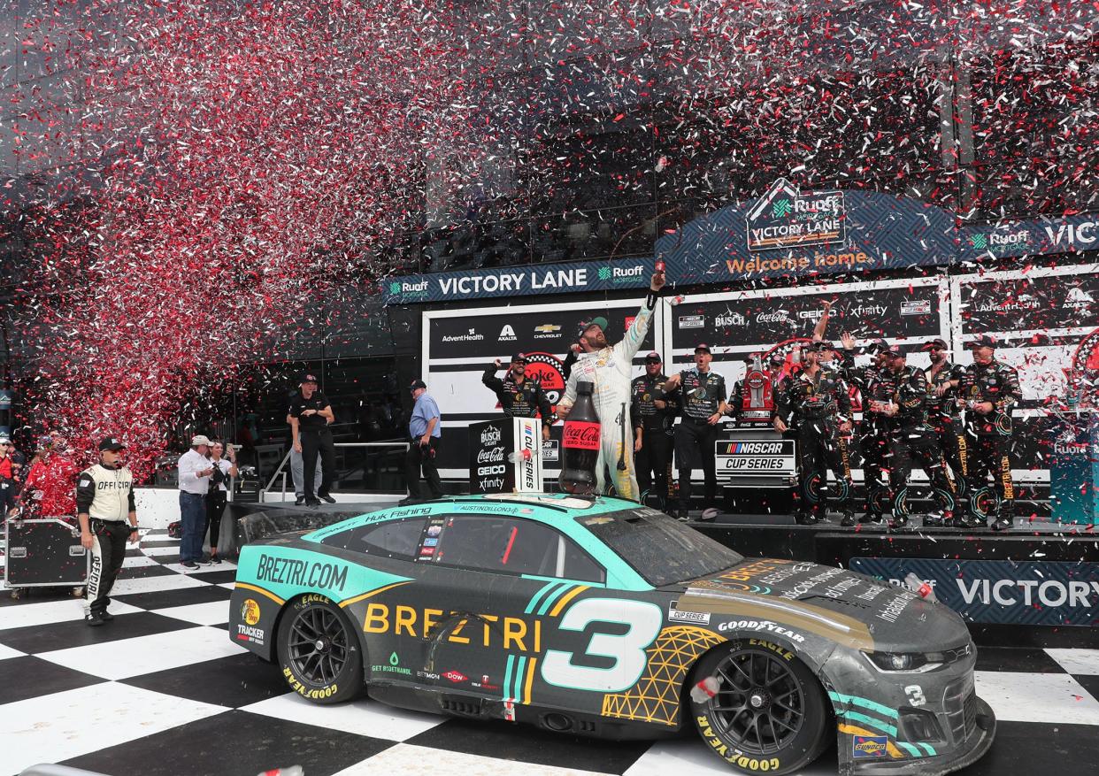 Austin Dillon stands on his no. 3 Chevrolet in Victory Lane, Sunday August 28, 2022 after winning the Coke Zero Sugar 400 at Daytona International Speedway.