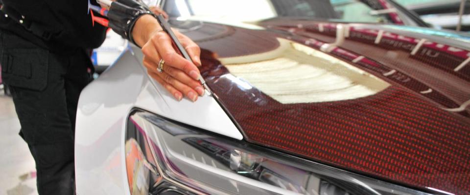 A car wrap being applied