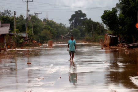 A man walks on a street during the flood after the Xepian-Xe Nam Noy hydropower dam collapsed in Attapeu province, Laos July 26, 2018. REUTERS/Soe Zeya Tun