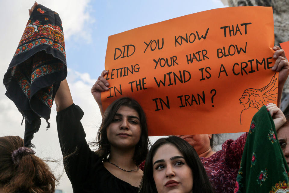 <b>Lebanon, Beirut</b> Kurdish women wave head scarves at a protest on Sept. 21, 2022.<span class="copyright">Marwan Naamani—Picture Alliance/Getty Images</span>