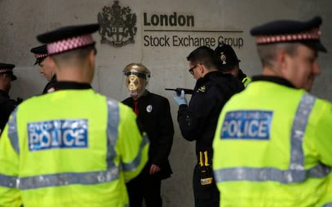 The activists have now been removed from the stock exchange - Credit: Matt Dunham/AP