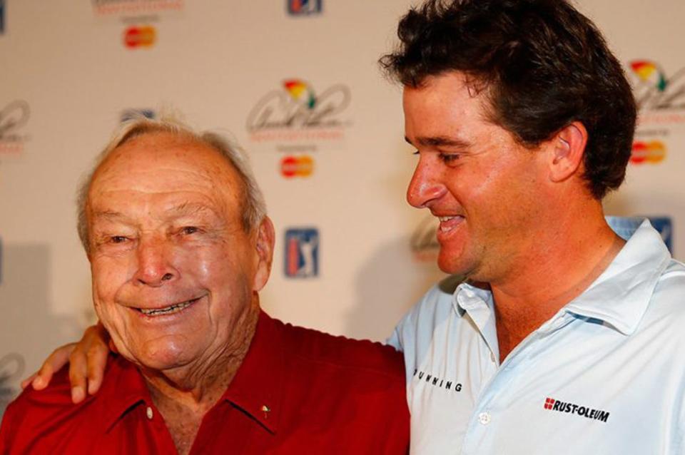 Arnold Palmer, shown with grandson Sam Saunders