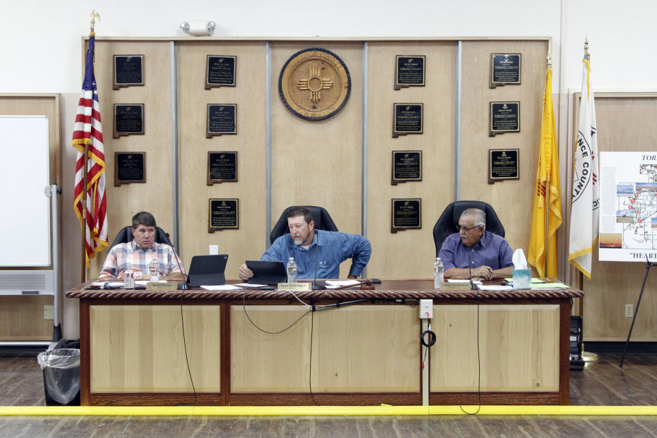 The Torrance County Board of Commissioners gathers in Estancia, N.M., Sept. 14 , 2022. Republican commissioners in the rural New Mexico county have tried everything they can think of to persuade voters that their elections are secure, and none of it seems to be working. They agreed to hand count ballots from the primary election, allowed the public to observe security testing of ballot machines and tasked their county manager with making sure those efforts ran smoothly. Still, many voters in Torrance County don’t trust voting machines or election results. (AP Photo/Morgan Lee)