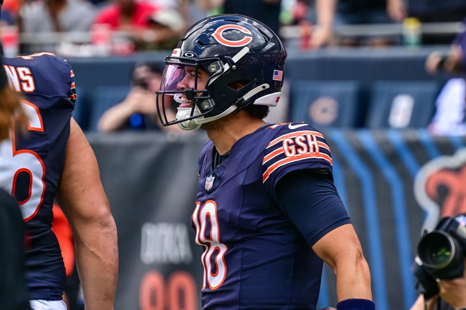 Aug 17, 2024; Chicago, Illinois, USA; Chicago Bears quarterback Caleb Williams (18) celebrates his rushing touchdown against the Cincinnati Bengals during the second quarter at Soldier Field. Mandatory Credit: Daniel Bartel-USA TODAY Sports